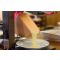 fromage fondu dans un appareil à raclette traditionnel de la marque LOUIS TELLIER