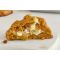 Gros plan sur un cookie pistache cœur coulant chocolat blanc